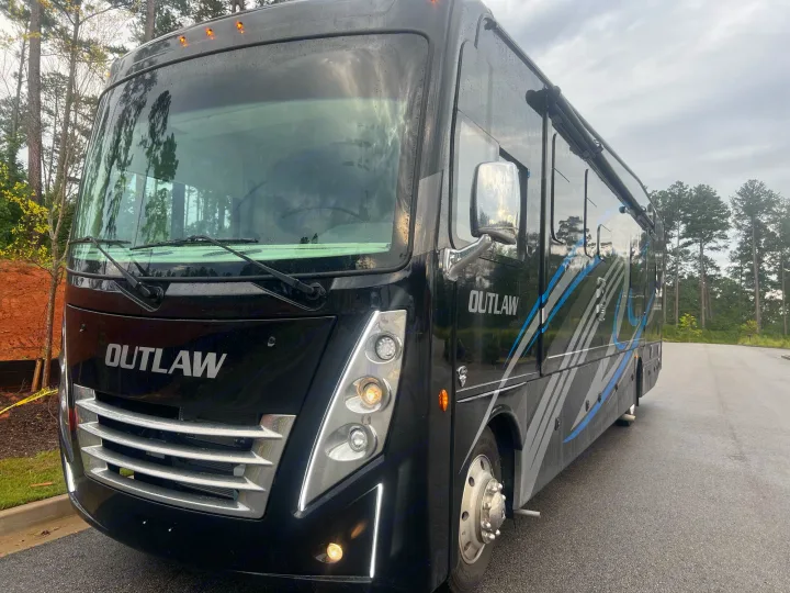 Explore in style! This black Outlaw motorhome RV rental features cool blue and grey graphics. Ready for your next adventure.. Thor Outlaw 2022