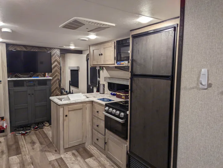 Plenty of cabinet and counter space. Also included is an outdoor kitchen furnished with a fridge, sink, griddle, and more storage. KZ CONNECT SE 2021