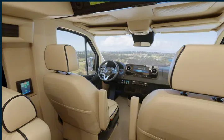 Spacious RV rental interior with modern dash, plush seating, and scenic views for your next adventure.. Ultimate Toys Ultimate RV 2023