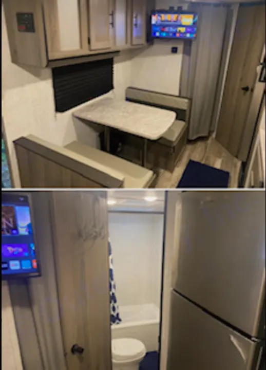 RV rental interior featuring a dinette, kitchen area, compact TV, and small bathroom with a tub and toilet.. Gulf Stream Enlighten 2022