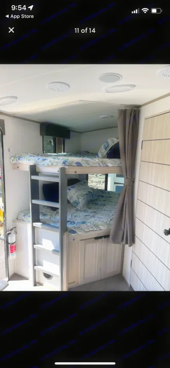 Cozy RV rental featuring stacked bunk beds with playful camper-themed bedding, practical storage, and a bright interior.. Shadow Trailers 277bhs 2022