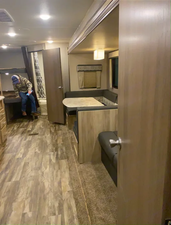 Cozy RV rental interior with dinette, bunk beds, and bath, perfect for comfortable travel.. Forest River Coachmen Catalina Legacy 2020