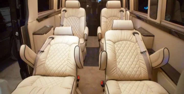 This RV rental features a luxurious interior with cream, quilted leather seating. Enjoy premium comfort and ample room for travel.. Ultimate Toys Ultimate Coach 2022