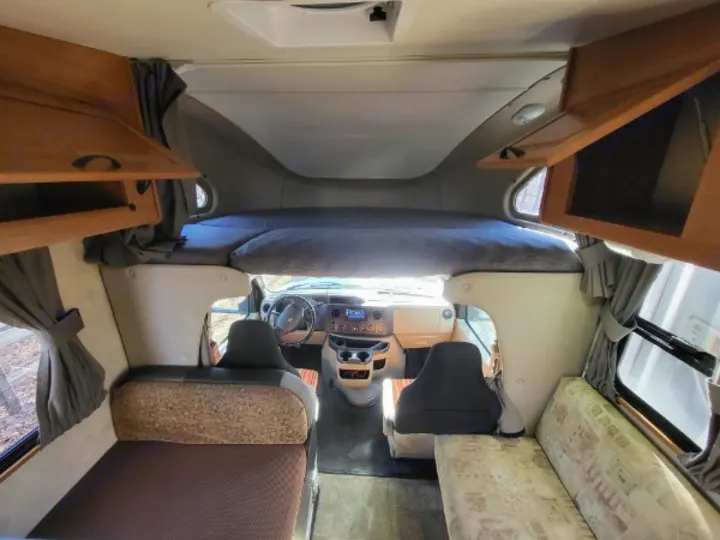 Step inside this functional RV rental! Features include an overhead bunk, side bench/bed, and cozy sofa lounge.. Thor 2012 Thor 19G 2012