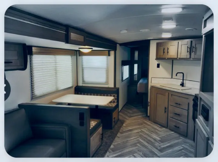 Step inside this cozy RV rental: dinette, full kitchen, and lounge space. Ready for your next adventure!. Cruiser Rv Corp Shadow Cruiser 2021