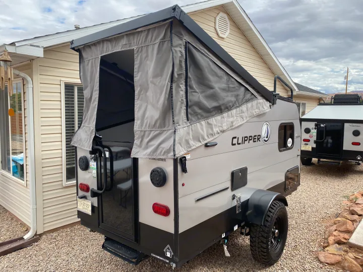 This Coachmen Clipper pop-up rv rental, an outdoor camping trailer, is ready for adventure with its canvas top extended.. Coachmen Clipper Express 9.0 TD 2022