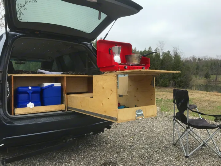 RV rental potential! This SUV's custom overland kitchen with stove and water storage makes car camping easy.. Toyota Sienna 2010