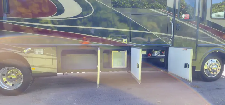 This RV rental offers spacious open side storage, including an outdoor fridge and utility access.. Bounder Bounder Motorhome 2021