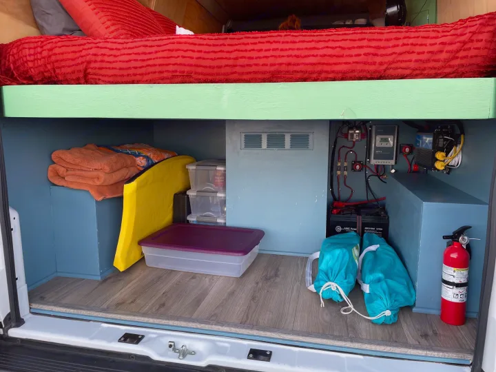 Inside this RV rental, discover smart storage under an elevated bed, a complete electrical system, and safety equipment.. Dodge Ram Promaster 1500 2021