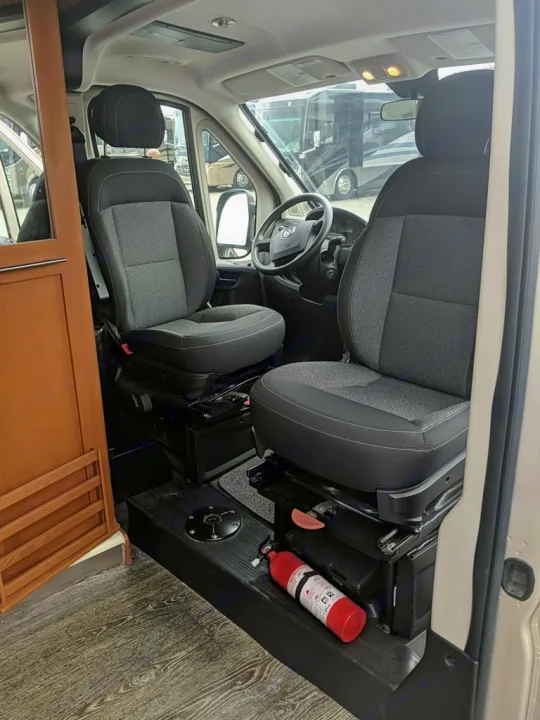 This rv rental features a spacious front cabin with two comfortable seats and an accessible fire extinguisher by the passenger floor.. Roadtrek Roadtrek Class B 2017