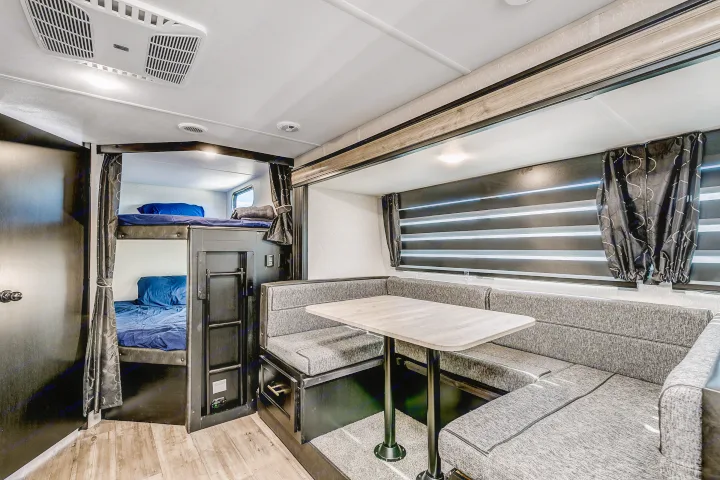 RV rental: Spacious interior with bunk beds, a cozy dinette, and modern amenities, ideal for family travel.. Cherokee 26DBH 2022