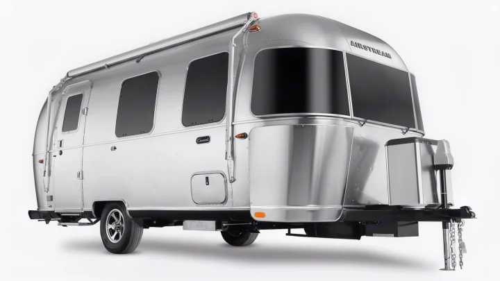 A sleek, silver Airstream travel trailer, an iconic RV, ready for your next rv rental adventure or road trip.. Airstream Caravel 2022