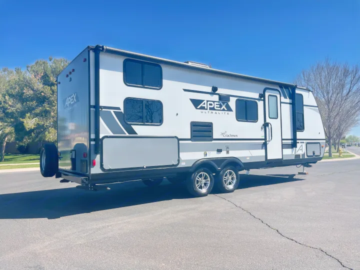 This sleek white and gray Apex Ultralite travel trailer is ready for your next rv rental and outdoor adventures.. Coachmen Apex 2022