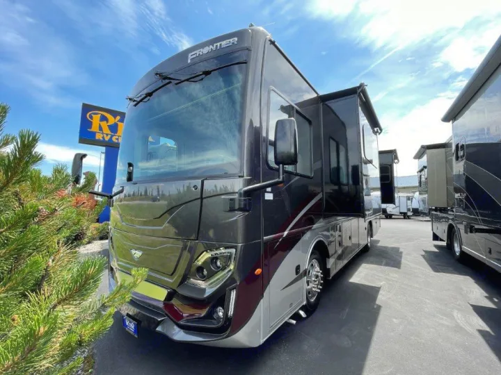 Sleek Frontier motorhome, perfect for your next RV rental adventure, shown at an RV dealership lot.. Fleetwood Frontier 2023