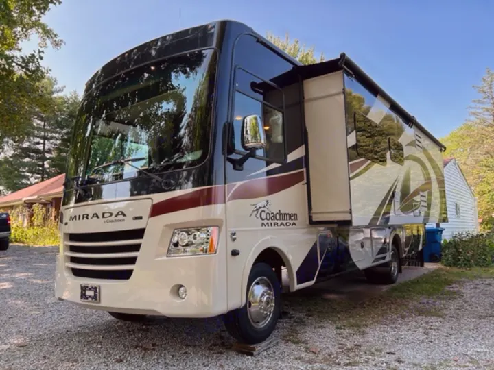 A pristine Coachmen Mirada Class A RV, with its slide-out extended, awaits its next RV rental journey. Perfect for trips!. Coachman Mirada 2018