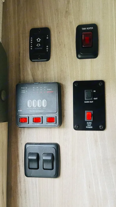 Awning/slide controls, gray/black/fresh tank and battery monitoring, indoor/outdoor light controls. Winnebago Micro Minnie 2021