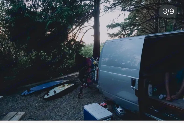 Explore with an RV rental! This silver converted van, equipped with surfboards & a bike, is ready for an outdoor adventure at camp.. Gmc Custom 1995