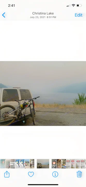 Mountain bike attached to an RV rental van, parked overlooking hazy Christina Lake on July 23, 2021. An outdoor adventure.. Gmc Custom 1995