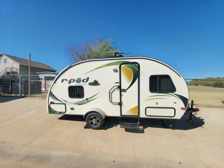 Explore with this R-Pod travel trailer, an excellent rv rental for compact adventures under a clear blue sky.. R-Pod R-Pod Trailer 2015