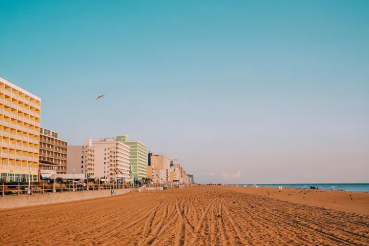 Vast sandy beach stretching along a coastline dotted with hotels and the ocean, perfect for an RV rental escape.. Jayco Jay 2015