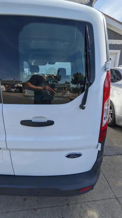 Rear view of a white Ford Transit van, popular for rv rental conversions.. Ford Transit Custom 2017