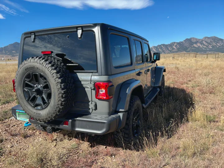 Gray Jeep Wrangler in CO mountains, ready for adventure. A rugged alternative for your next outdoor RV rental escape.. Jeep Wrangler 2022