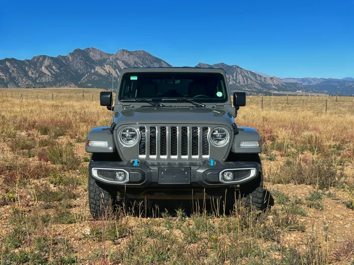 Rugged grey Jeep Wrangler in a dry mountain field. Your adventure vehicle, perfect for any rv rental trip.. Jeep Wrangler 2022