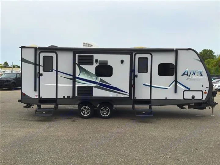 Modern grey Apex Ultra-Lite travel trailer, perfect for RV rental vacations or camping trips.. Coachmen Apex 2017
