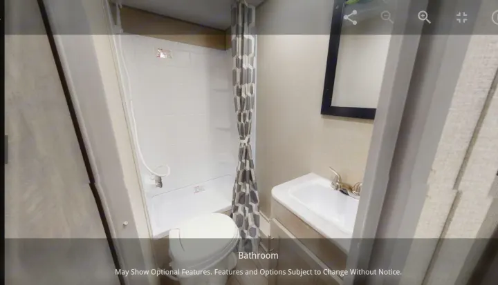 Explore the efficient bathroom in this RV rental, complete with a shower, toilet, and vanity with a sink and mirror.. Forest River Coachmen Catalina Summit 2022