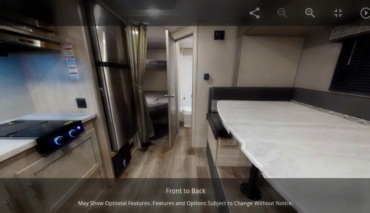 Spacious RV rental interior with kitchen, dinette, bunk beds, and bathroom, perfect for family camping or travel.. Forest River Coachmen Catalina Summit 2022
