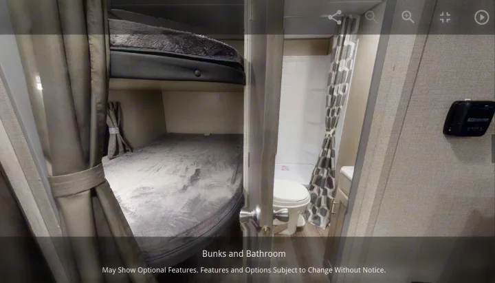 RV rental interior: cozy bunk beds next to a compact bathroom with a toilet and shower, ideal for family travel.. Forest River Coachmen Catalina Summit 2022