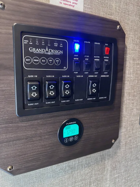 This RV rental's main control panel lets you manage slides, awnings, lights, water pump, and monitor tank & battery levels.. Grand Design Reflection 2022