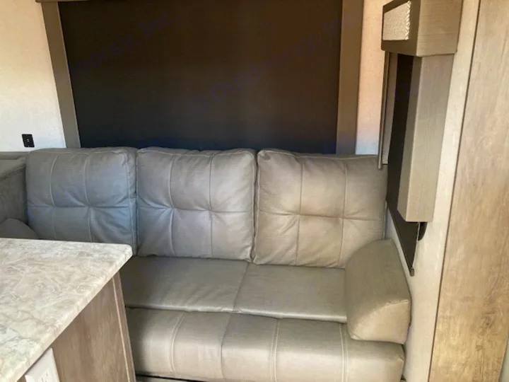 Experience comfort in this RV rental! View of the spacious dinette seating area with plush cushions & countertop.. Forest River Salem 2020