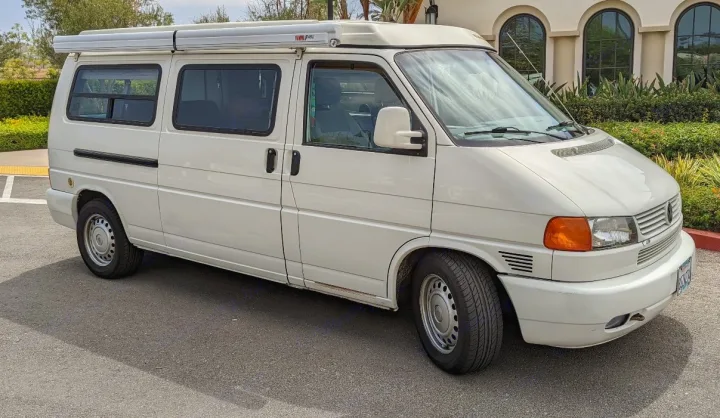 White camper van with awning & high roof, suitable for rv rental. A spacious mobile home for travel.. Volkswagen Eurovan 2001