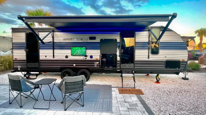 Enjoy your RV rental! This Grey Wolf travel trailer features an outdoor TV and kitchen for ultimate campsite relaxation.. Forest River Cherokee Grey Wolf 2022
