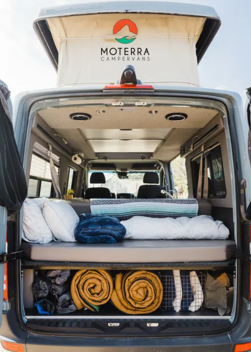 Moterra campervan RV rental interior showing bed, storage, and pop-top roof. Ready for adventure!. Mercedes-Benz Sprinter 2021