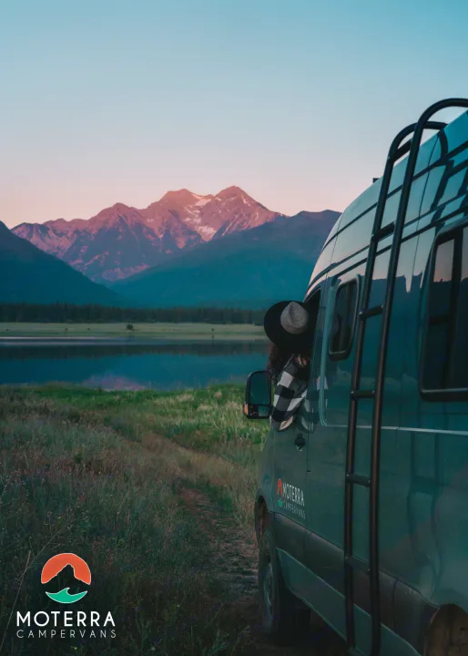 RV rental: Campervan parked lakeside at sunset with mountains & person in window. Perfect for scenic travel!. Mercedes-Benz Sprinter 2020