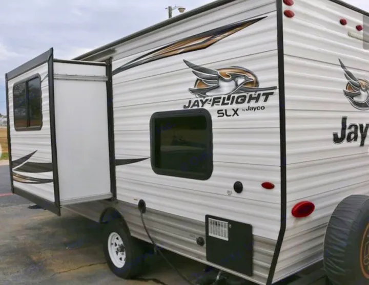 Exterior view of a Jayco Jay-Flight travel trailer rv rental, with a slide-out extended.. Jayco Jay Flight SLX 184 BS 2019