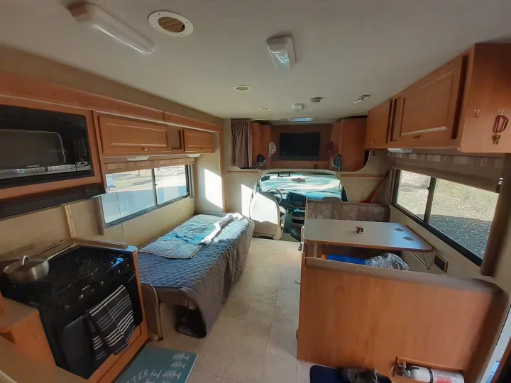 Step inside this RV rental, featuring a functional kitchen, comfortable sleeping area, and dining space for your road trips.. Winnebago Access 2008