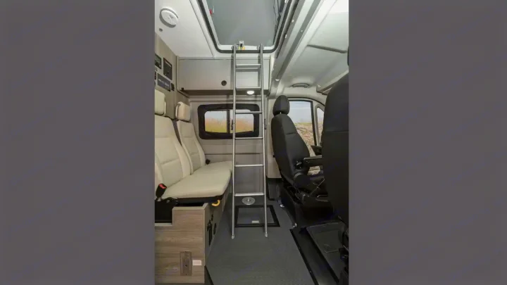 Step inside this RV rental, featuring comfortable seating, a versatile ladder to the bunk, and ample space for your journey.. Winnebago Solis 2021