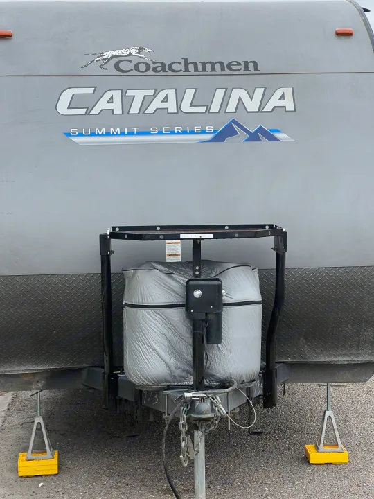 Coachmen Catalina Summit Series RV rental front, with covered propane tanks, power jack, and stabilizing jacks on blocks.. Coachman Catalina Catalina Summit Series 7 184BHS 2022