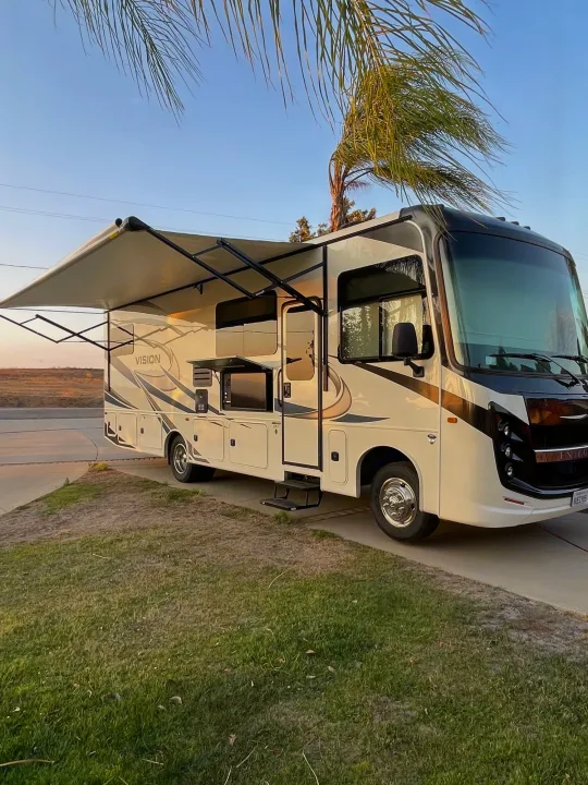 Experience outdoor living with this spacious rv rental, featuring an extended awning for shade and outdoor entertainment.. Entegra Coach Vision 29f Bunk house model 2021