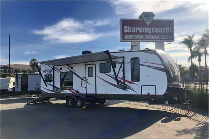 Spacious white travel trailer for RV rental, with awning extended, parked at Sharemycoach! privately owned R.V. rentals.. Cruiser Rv Corp Stryker 2018