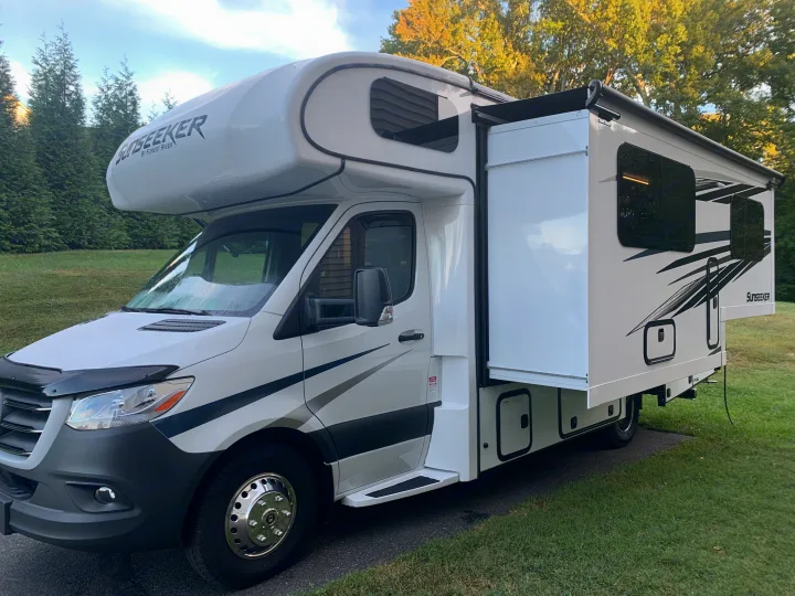 Explore with this white Sunseeker Class C RV rental, ready for your next adventure with its extended slide-out.. Forest River Sunseeker 2022