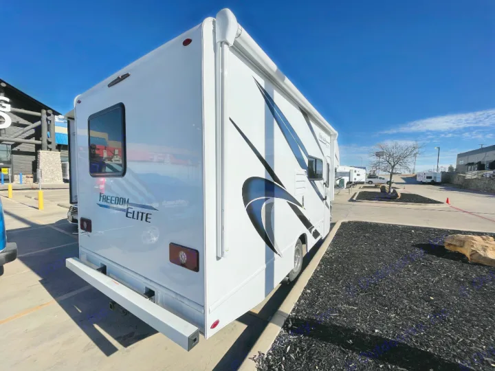 This white Freedom Elite RV rental with graphic decals is ready for your next road trip adventure under clear skies.. Thor Freedom Elite 2022