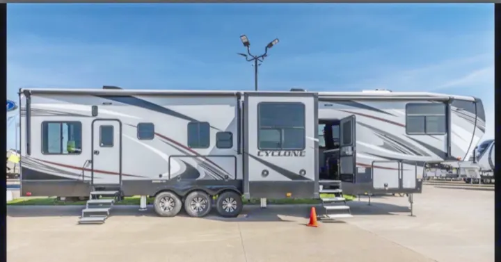 Discover this spacious Cyclone fifth-wheel toy hauler, an ideal RV rental for outdoor adventures. Extended slide-outs enhance living space.. Heartland Cyclone 2018