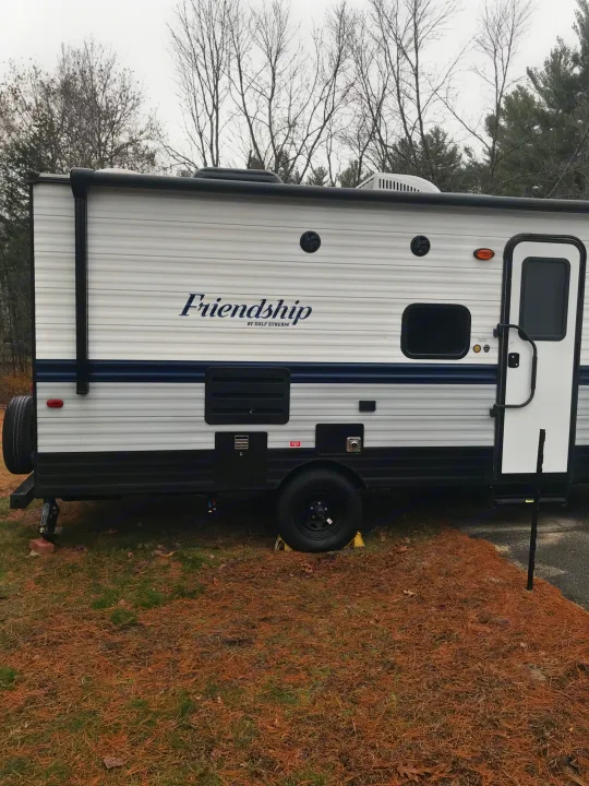 Friendship RV rental parked at a serene campsite, ready for adventure amidst nature.. Gulf Stream Friendship 2022