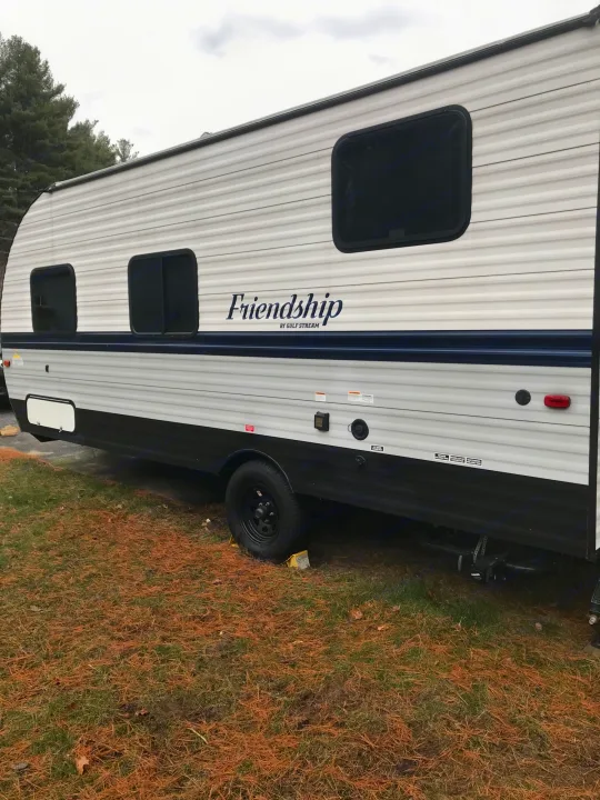 This Gulf Stream Friendship RV rental offers adventure. White & black exterior with windows, ready for your next trip.. Gulf Stream Friendship 2022