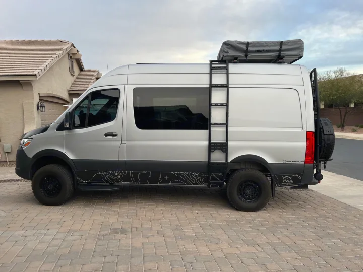 This customized silver Sprinter van with a rooftop tent is ready for your next RV rental adventure.. VanCraft Mercedes Benz 2022