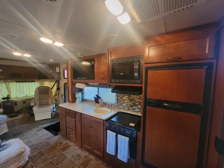 View from dinette looking at kitchen and front door. 2014 Ace 2014